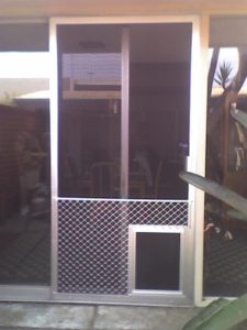 Dog Door Screens Orange County: Pacific Screen Doors' installation of durable, vinyl-coated dog-proof screen mesh for homes in Orange County, CA.